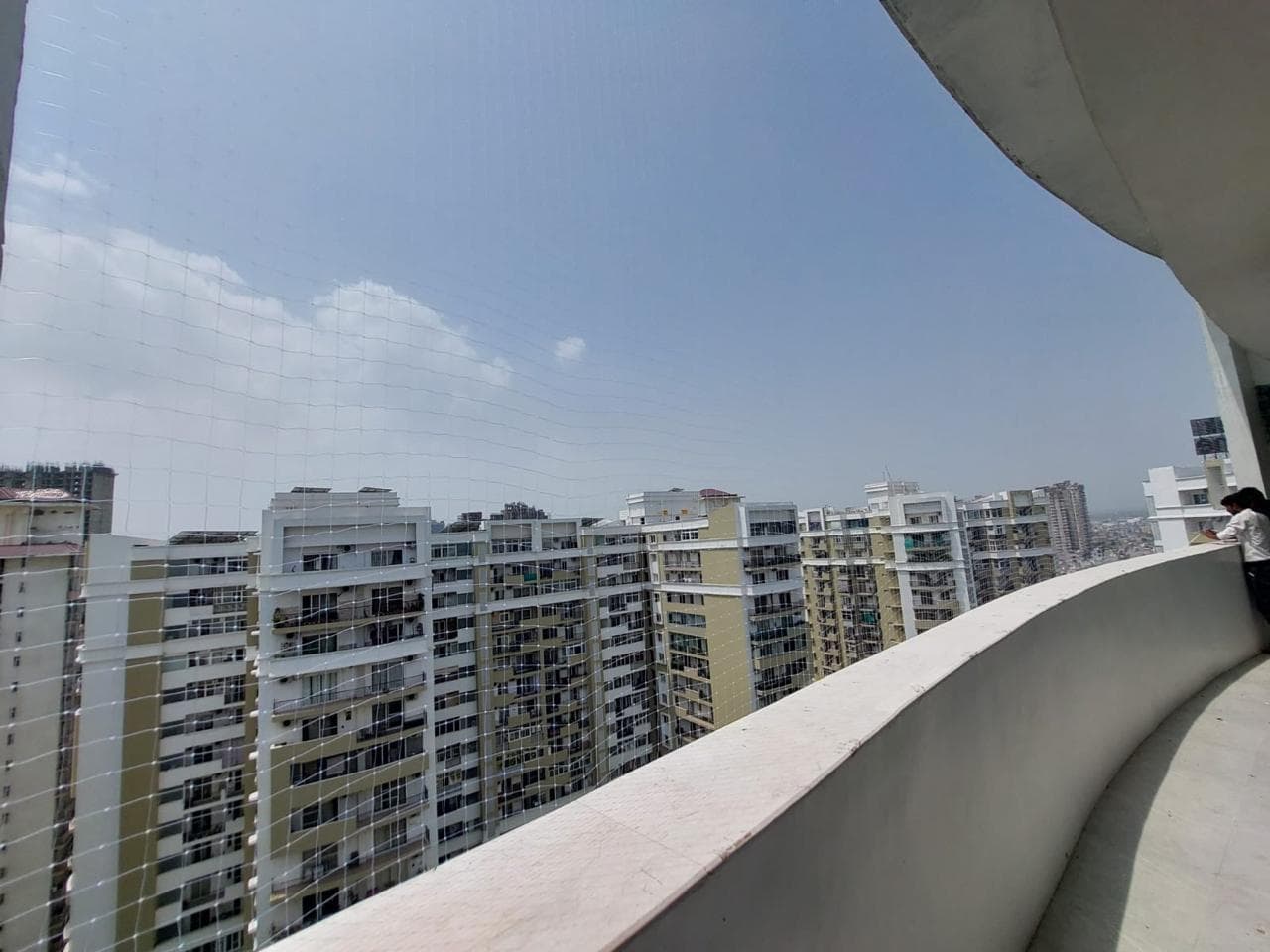 Clean curved balcony net finish after install
